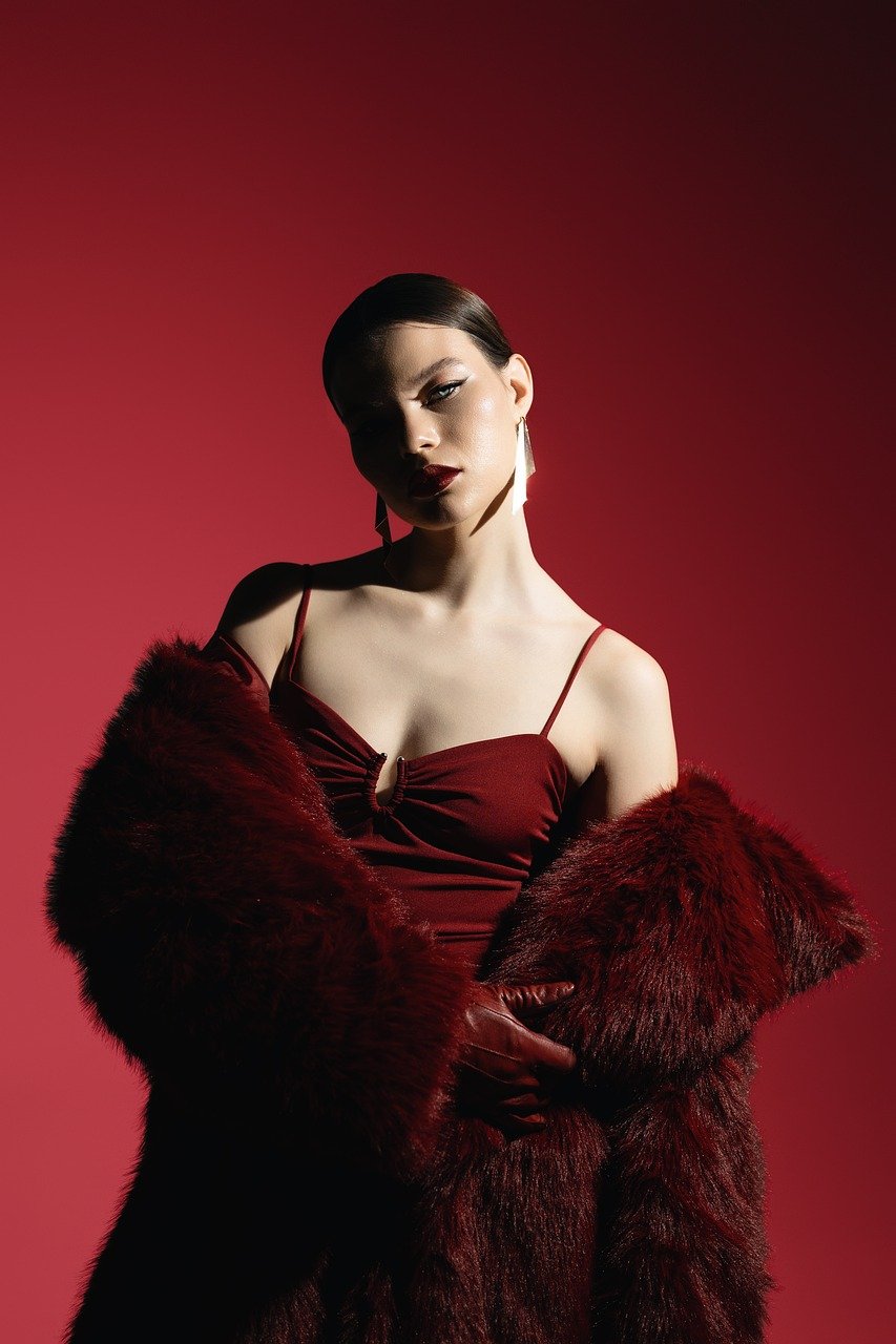 fashion photography, editorial portrait, luxury style, high fashion, dramatic lighting, glamorous look, bold makeup, sophisticated beauty, designer outfit, couture fashion, moody aesthetic, fashion model, powerful woman, modern elegance, striking pose, rich textures, studio shoot, artistic expression, vogue aesthetic, timeless glamour